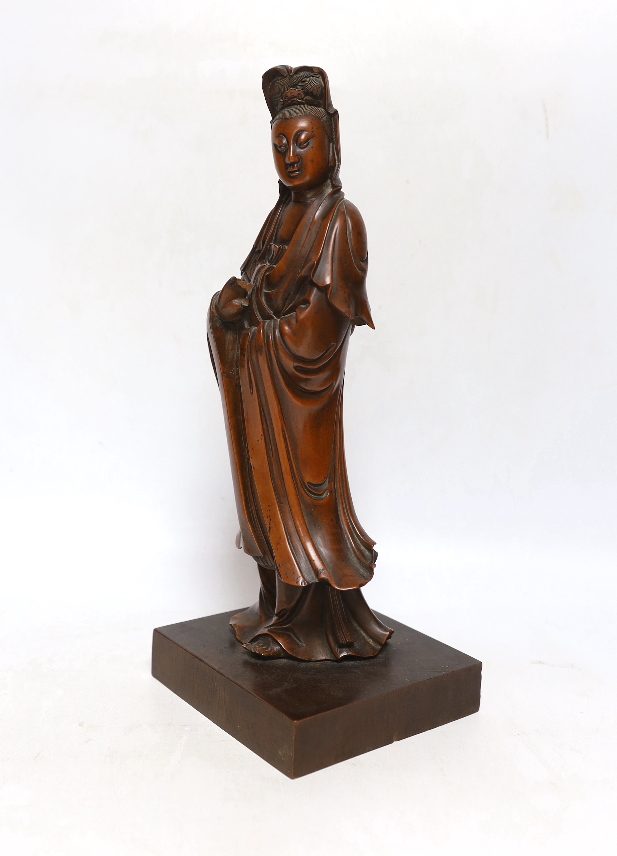 A Chinese carved boxwood figure of Guanyin, 19th century, 37cm high